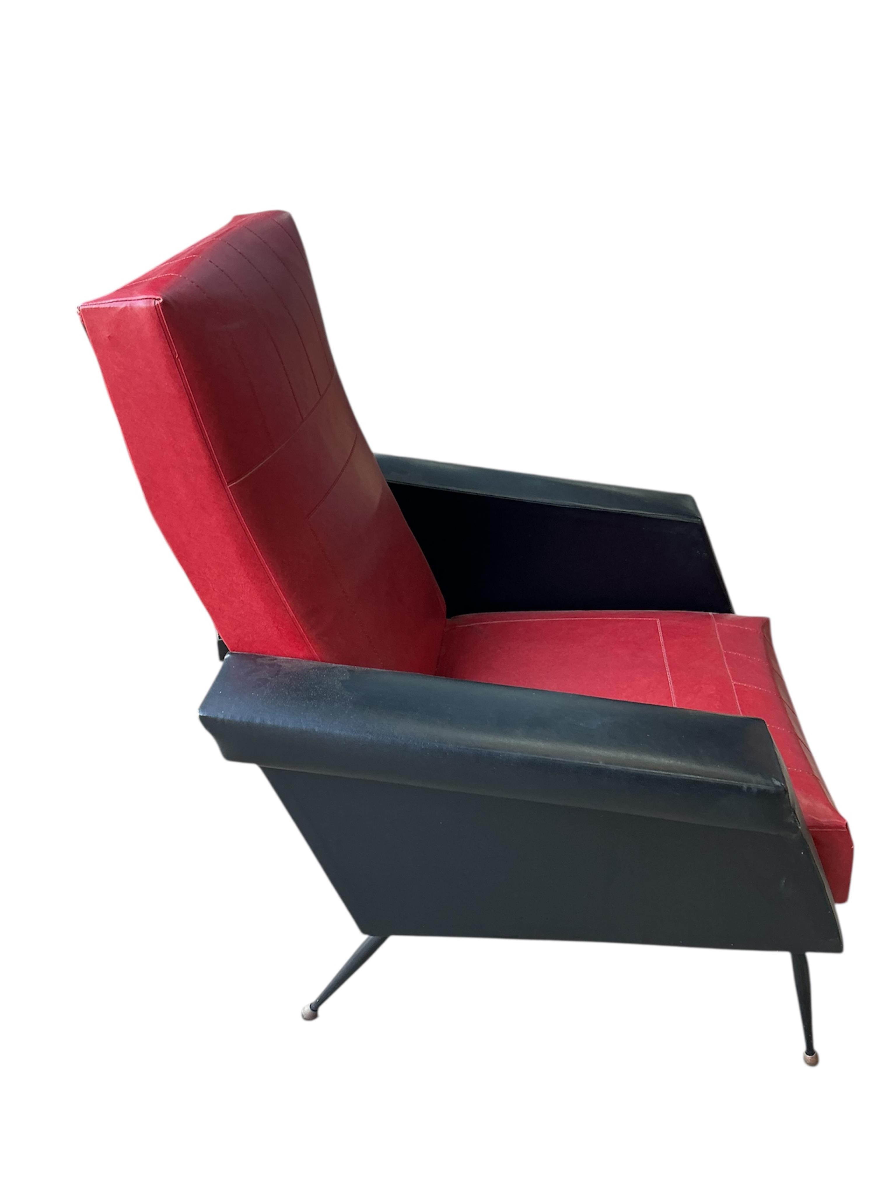 A pair of 1970's leatherette armchairs, width 74cm, depth 78cm, height 93cm